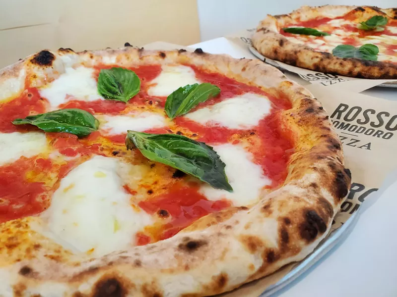 Image: a pizza with tomato sauce, mozzarella and basil