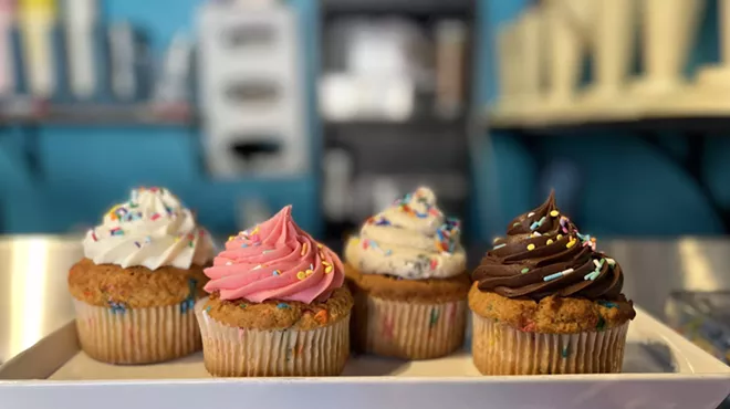 A shelf of cupcakes
