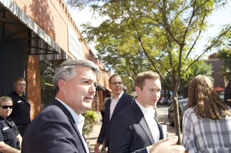 Image: Cory Gardner turns to respond to a constituent.
