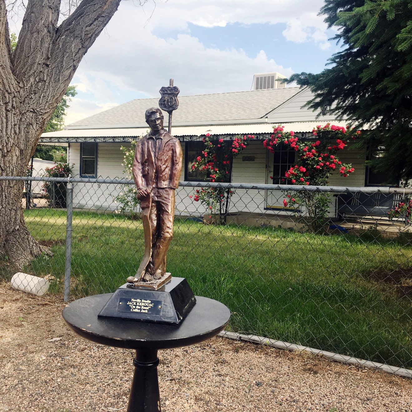 Howard Neville's sculpture of Jack Kerouac in front of the Lakewood home he once owned.