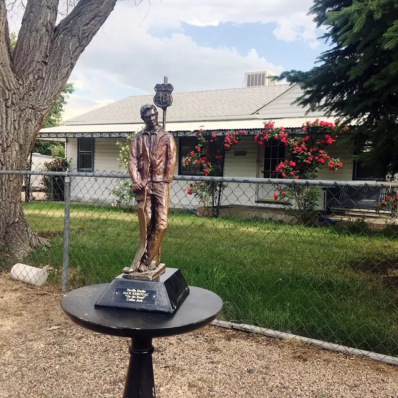 Image: Howard Neville's sculpture of Jack Kerouac in front of the Lakewood home he once owned.