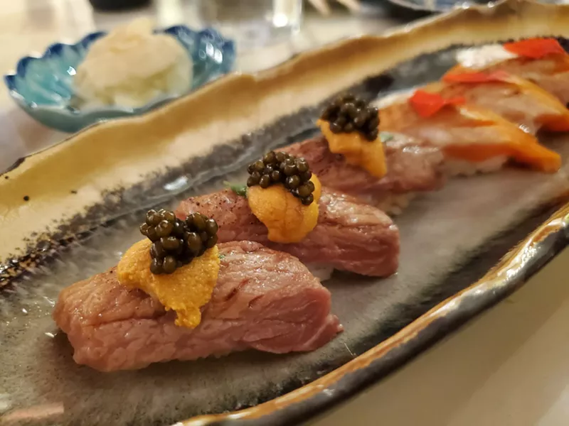 Image: nigiri lined up on a plate