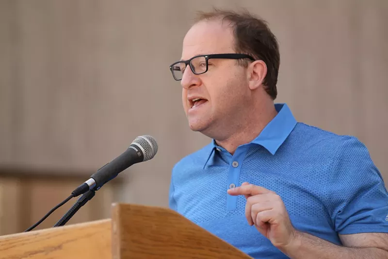 Image: Representative Jared Polis addresses a Denver crowd on April 15.