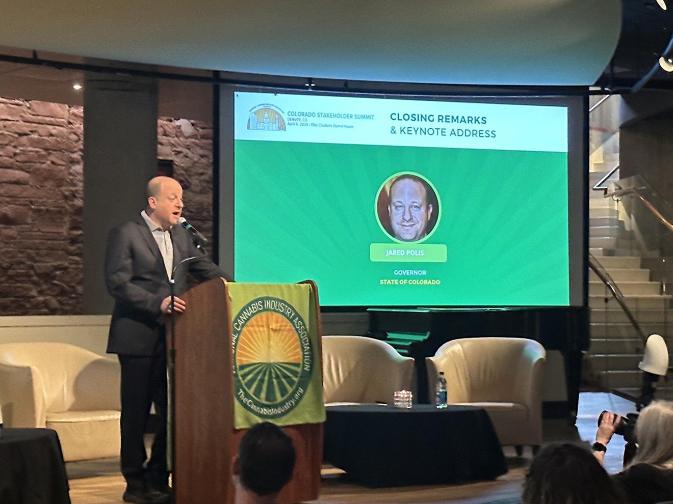 Governor Jared Polis speaks to an audience of marijuana business owners and executives on  April 4 in downtown Denver.