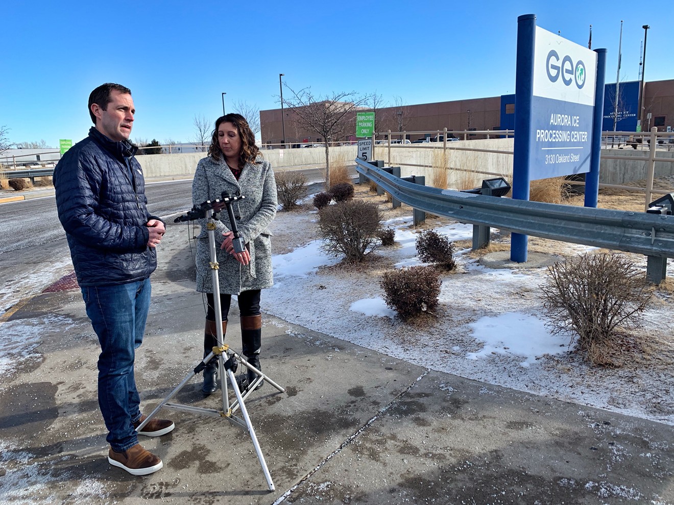 Congressman Jason Crow and Allison Hiltz of Aurora City Council outside the immigration detention facility in Aurora in February.