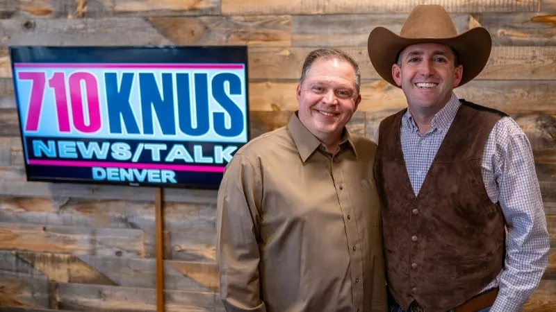 Image: two men hosting radio show