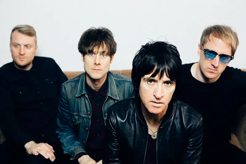 Image: Johnny Marr (front) performs at the Gothic Theatre on Thursday, May 16.