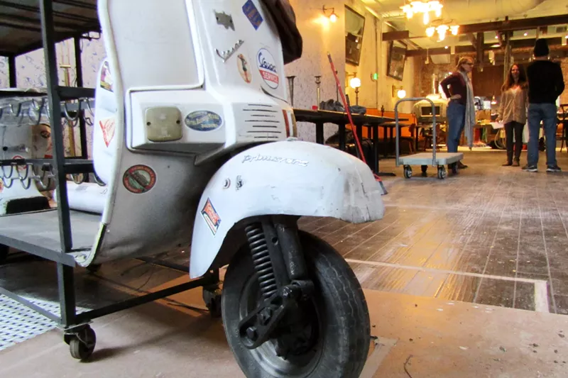 Image: A Vespa scooter finds second life as a host stand at Jovanina's.