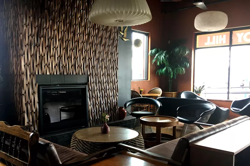 Image: A fireplace and comfortable seating welcome guests at Joy Hill.