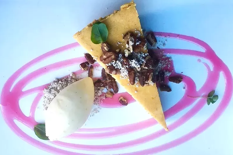 Image: Pumpkin cheesecake with orange-honey ice ceam, hibiscus syrup and roasted pecans.