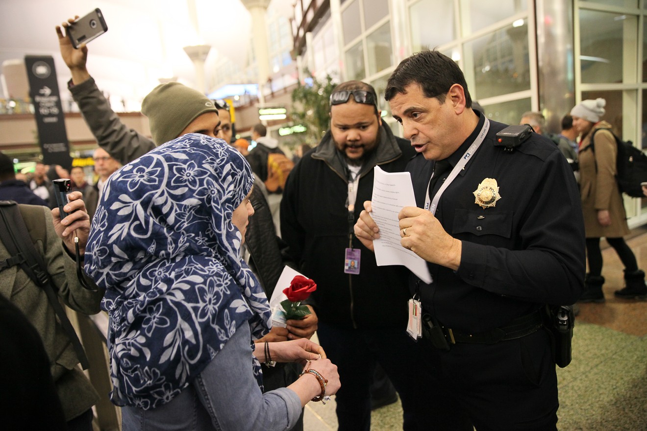 Amal Kassir discusses permits with DPD Commander Antonio Lopez on January 28.