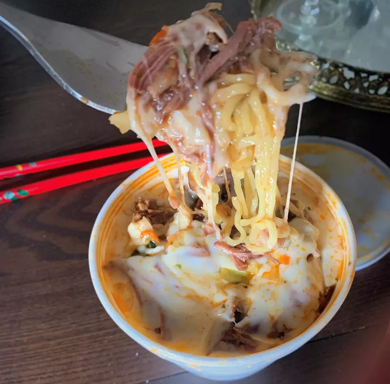 Image: Cheese, birria and ramen noodles come together thanks to Kiké's Red Tacos food truck.