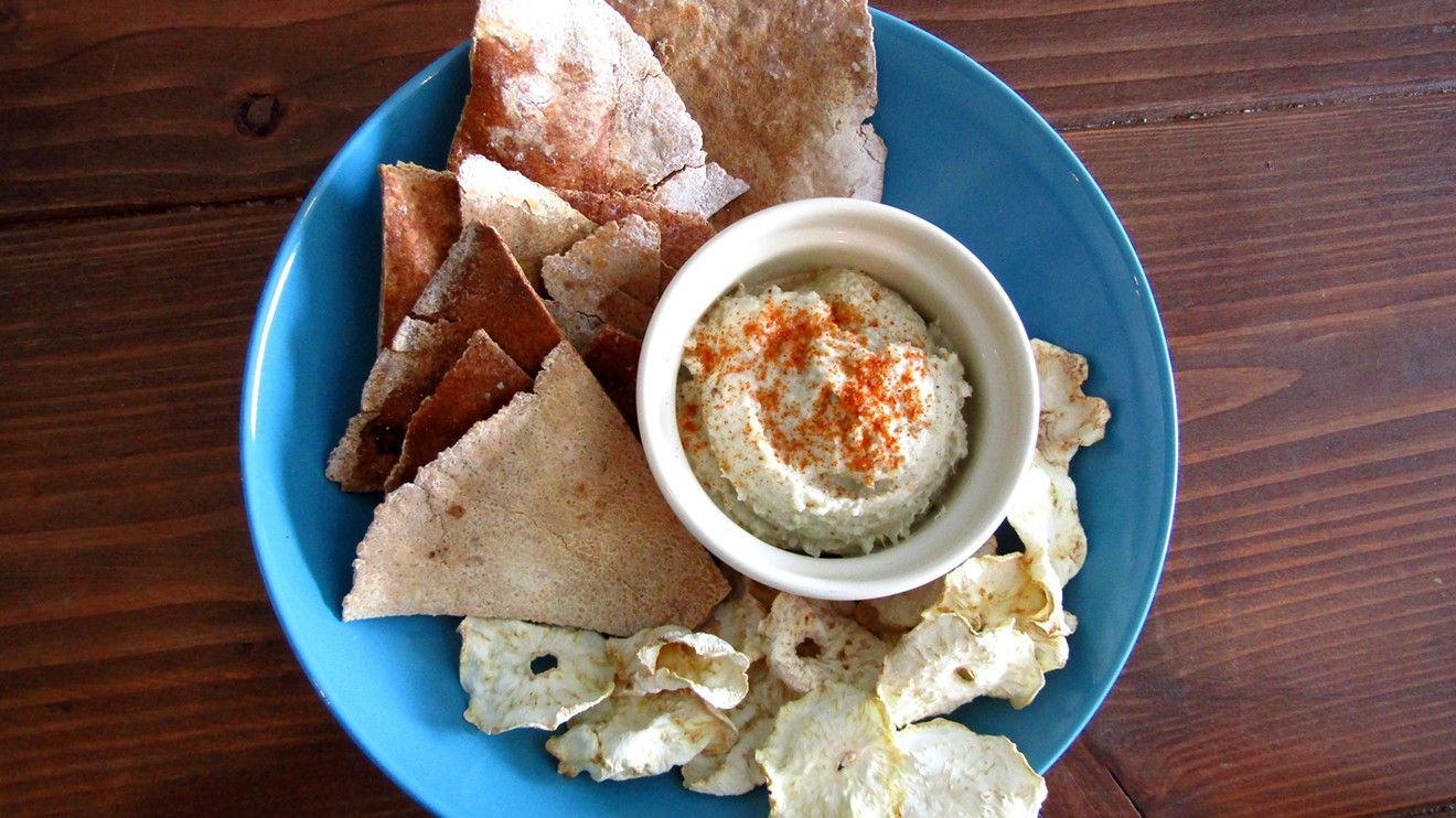 Cauliflower hummus with tortilla crisps and celery root chips.