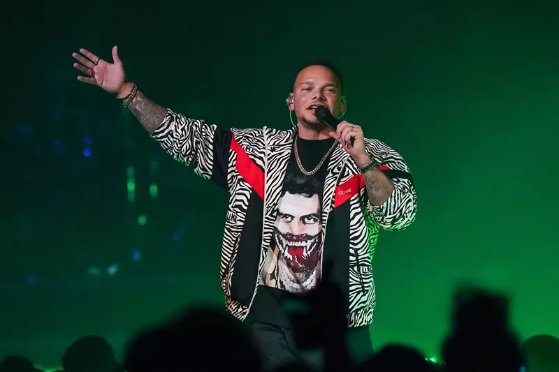 Image: man rapping into microphone