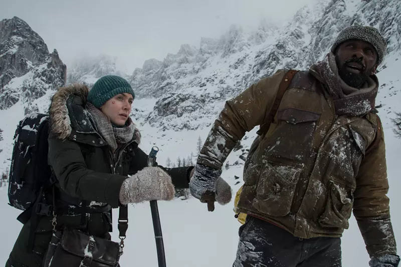 Image: Idris Elba (right) and Kate Winslet are strangers who are brought together after the small plane they charter crashes in the high country in The Mountain Between Us.