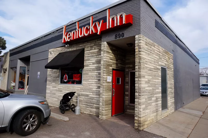 Image: The stroller parked outside of the Kentucky Inn is evidence of a changing clientele.