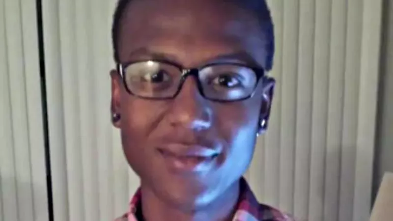 Image: young black man in glasses