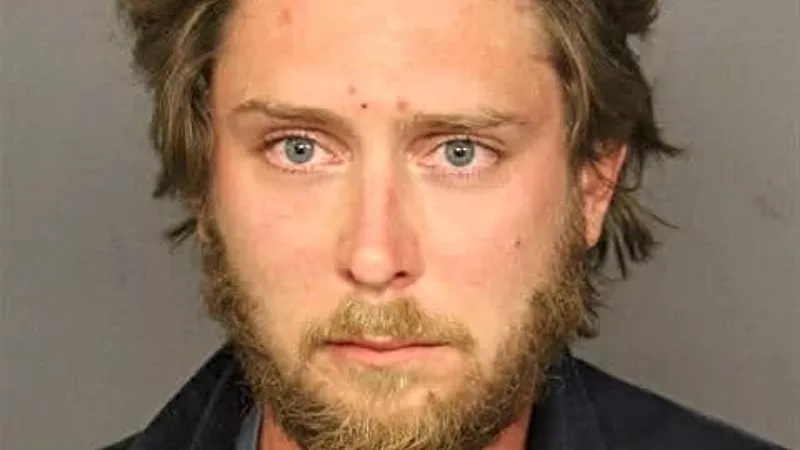 Image: The October 2020 booking photo of Matthew Dolloff.