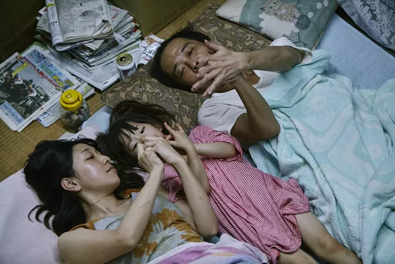 Image: In Hirokazu Kore-eda's Shoplifters, the heads of a household trying to survive include father Osamu (played by Lily Franky, right) and his wife, Nobuyo (Sakura Ando, left), who find a young girl named Yuri (Miyu Sasaki) and decide to keep her.