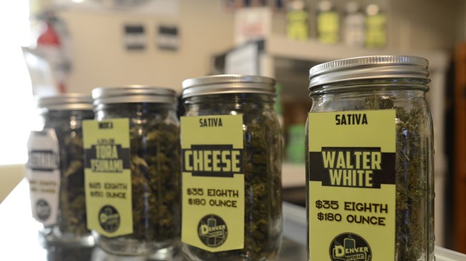 Jars of cannabis flower for sale inside a Denver dispensary