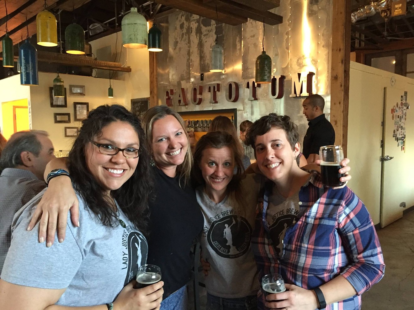 Factotum co-owner Laura Bruns (second from left) with the owners of Lady Justice.
