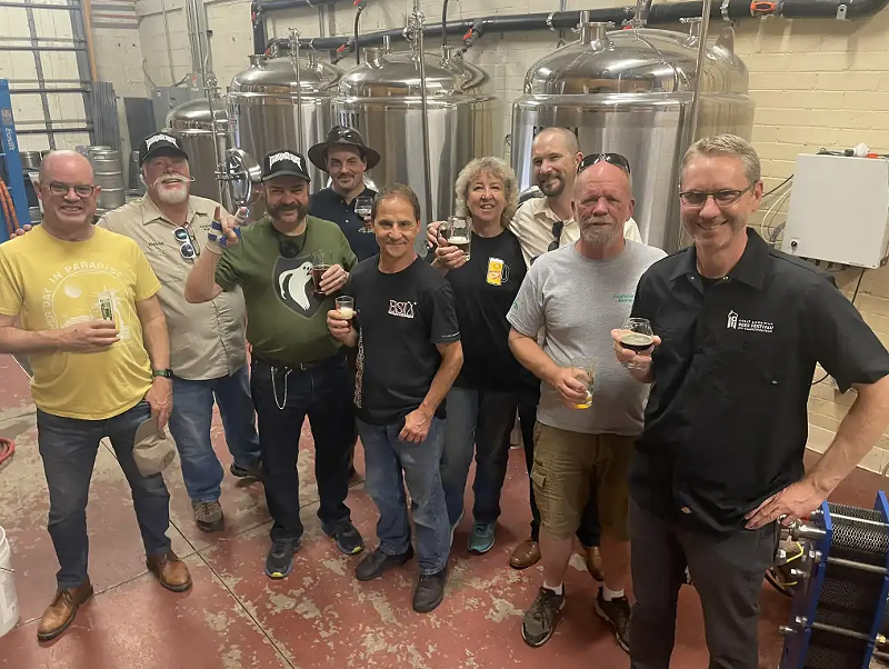 Image: Group of men in a brewery