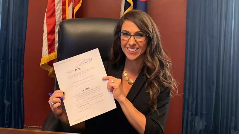 Image: Representative Lauren Boebert holding her bill concerning the World Health Organization and China.