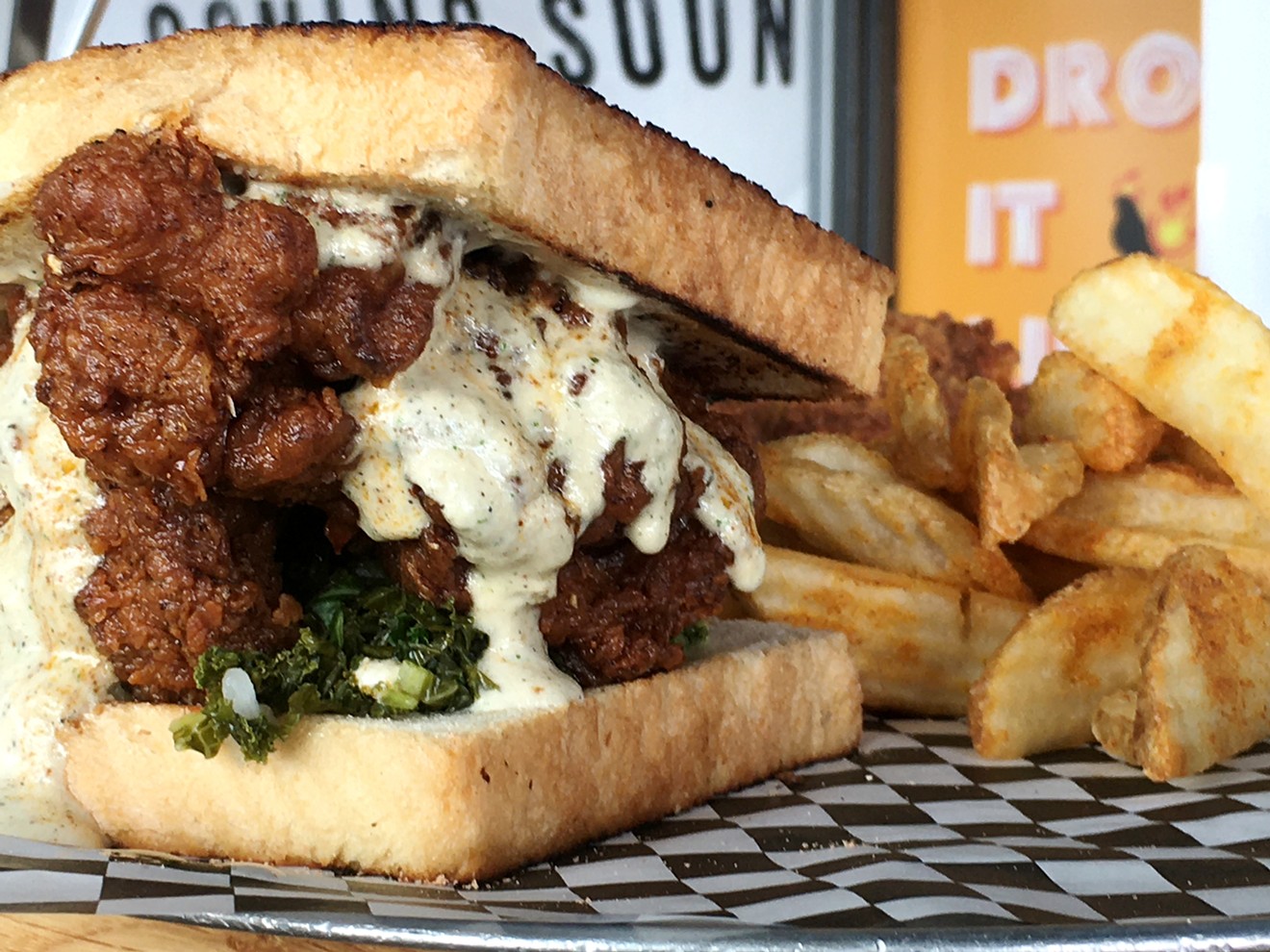 Chef Nick Graves makes his hot chicken sandwich with charred-onion ranch, kale kimchi and "Devil Dust."