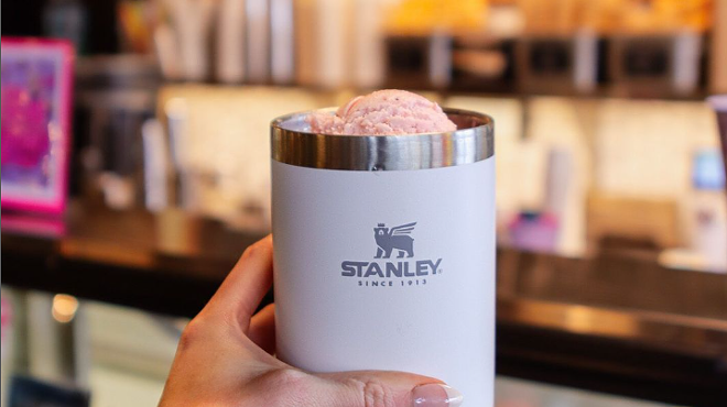 hand holding a stanley cup filled with ice cream