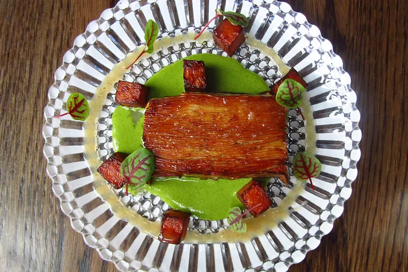 Image: Finely sliced king trumpet mushrooms make the many layers of this appetizer at LeRoux.