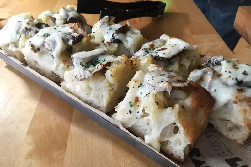 Image: Liberati adds Roman-style pizza, including this one topped with potatoes, cheese, mushrooms and black truffle pâté, to its menu.