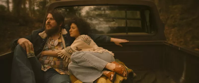 Image: Ben Dickey (left) plays late Texas singer-songwriter Blaze Foley, who lives in an off-the-grid cabin with actress and writer Sybil Rosen (Alia Shawkat), in Blaze, Ethan Hawke’s impassioned and uncompromising study of musicians on the margins.
