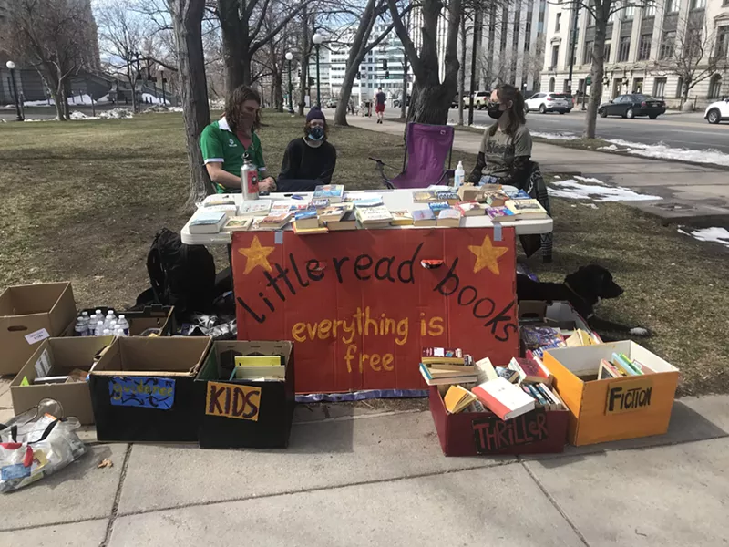 Image: Little Read Books sets up a free book stand at the corner of Grant and Colfax every Saturday.