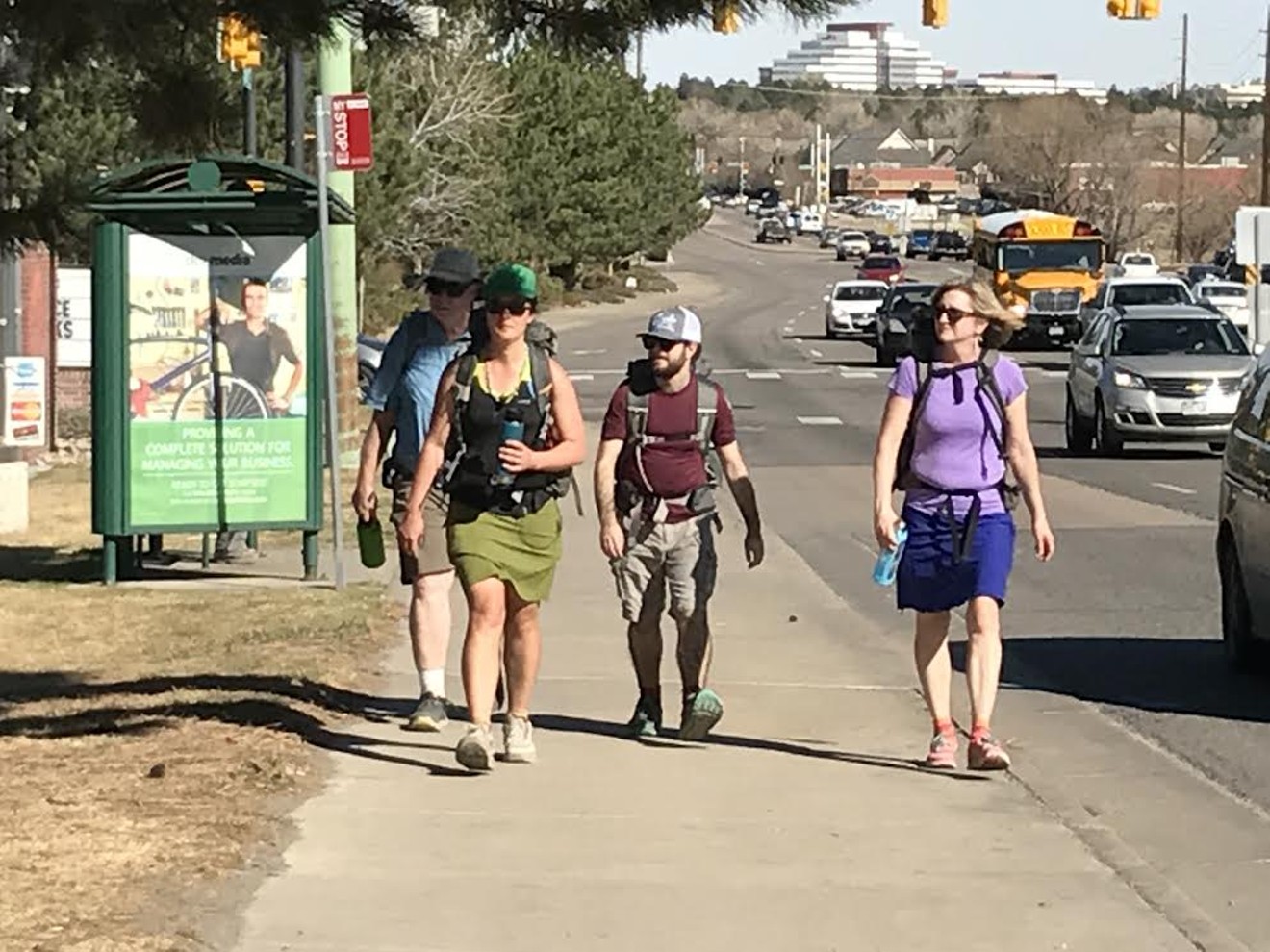 Liz Thomas (second from left) and her companions approach Comrade Brewing along Iliff Avenue.