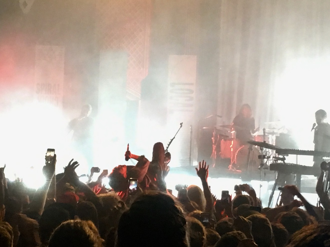 Local Natives singer Taylor Rice crowdsurfing during the song "Sun Hands."