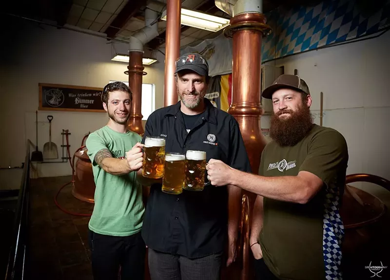 Image: Brad Landman (center) has been toasting at Prost since 2014.