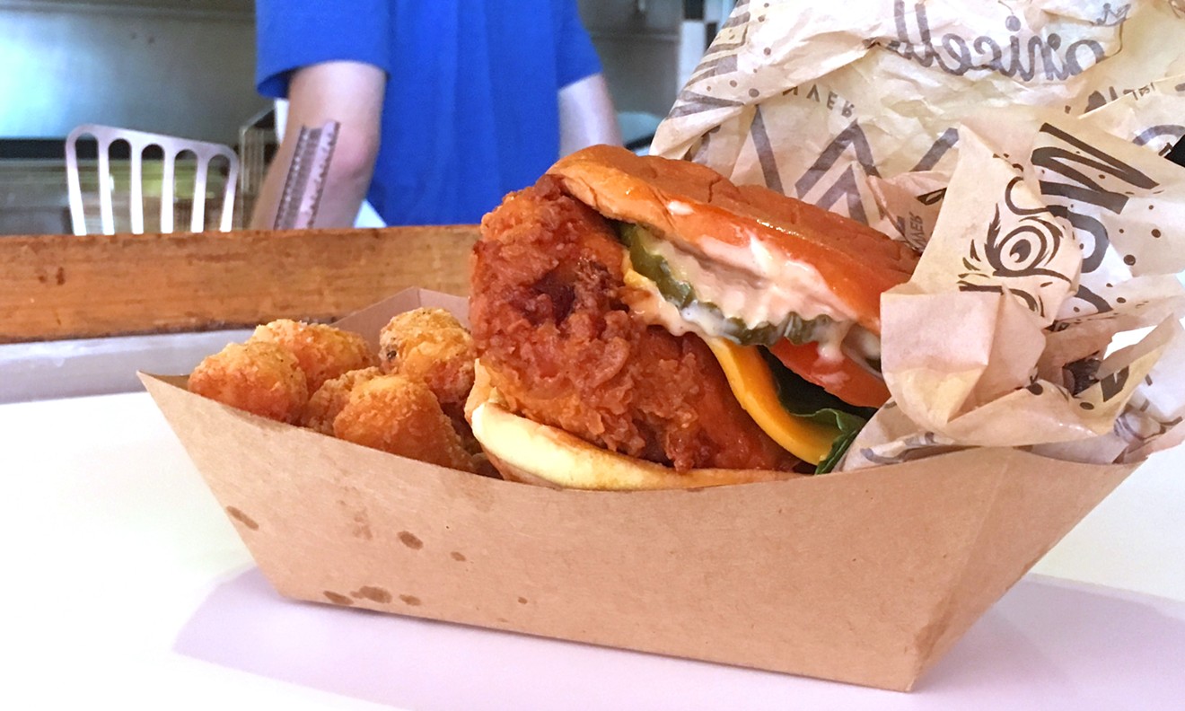 The Lou's Plus hot chicken sandwich with tots.