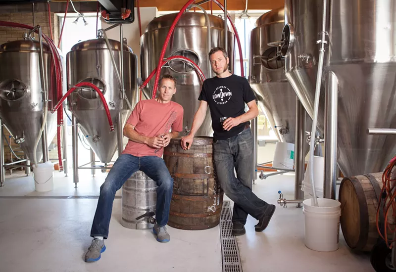 Image: Two men standing in front of a fermenter