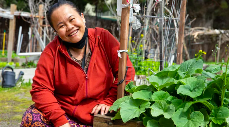 Image: woman smiling in a garden