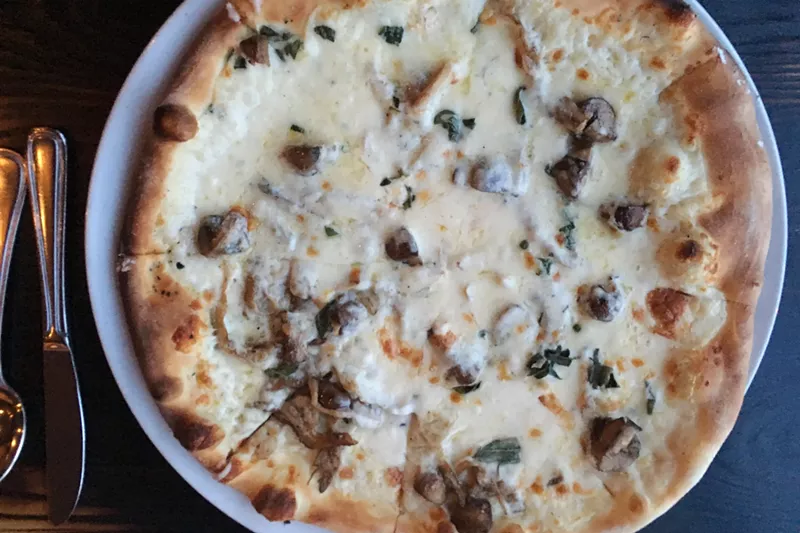 Image: Luca's new wild-mushroom pizza with bechamel, taleggio and truffle oil.