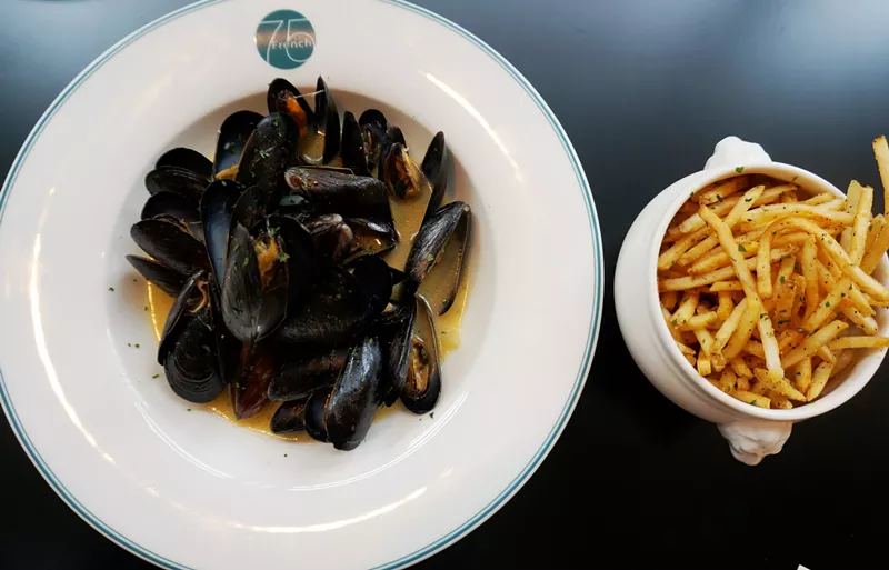 Image: Moules frites — and a serving dish with the French 75 logo.