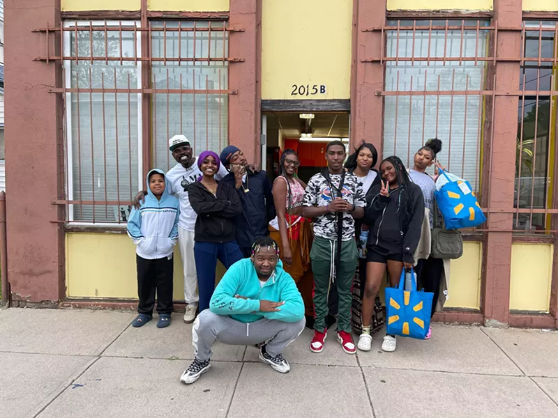 Image: Youth and staff outside the Make a Chess Move main office in East Denver.