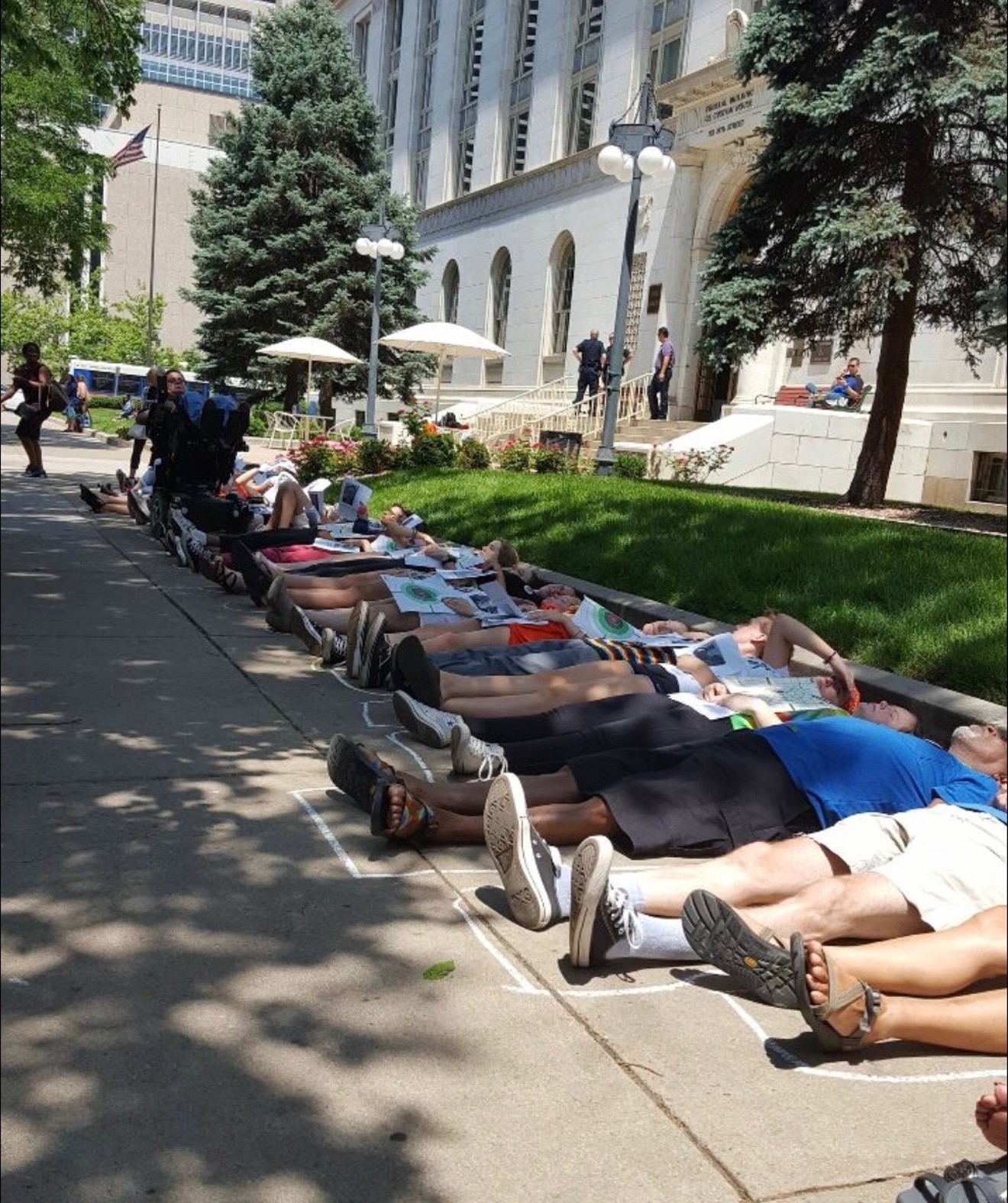 Students stage a "die-in" outside of Senator Cory Gardner's office, similar to the one planned for Saturday at the Capitol.