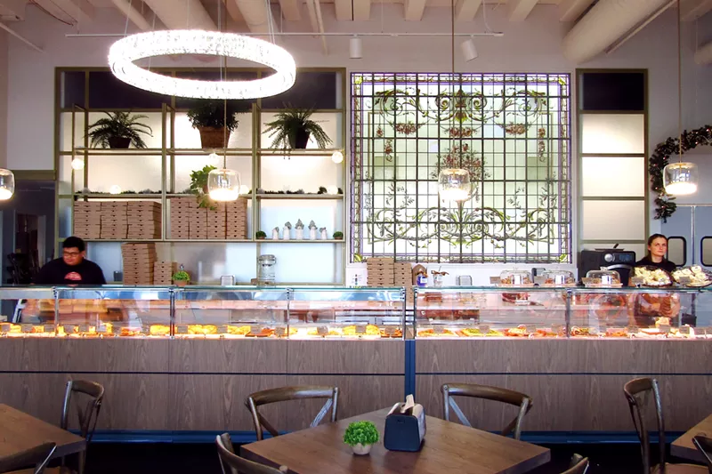 Image: An antique stained-glass window adds a touch of Buenos Aires to Denver's newest Maria Empanada.