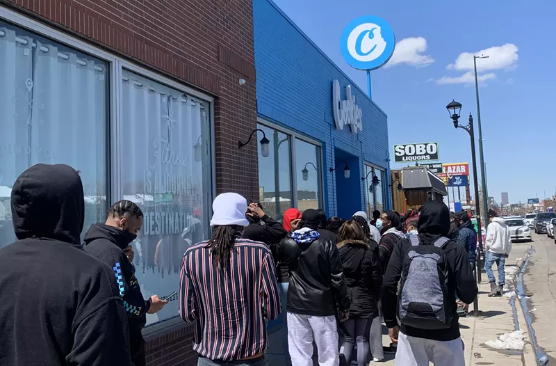 Image: Customers wait in line as 4:20 approaches at Cookies dispensary on South Broadway.