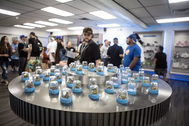 Image: Customers shop at a Cookies dispensary in Commerce City.