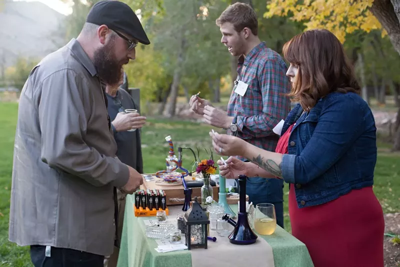 Image: Mason Jar event attendees chat with budtenders at the cannabis bar during a dinner pairing in 2018.