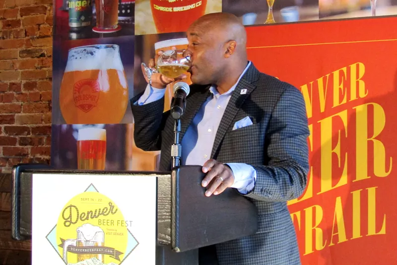 Image: Denver Mayor Michael Hancock enjoys a breakfast beer at Odell Brewing Company for the launch of Denver Beer Fest.