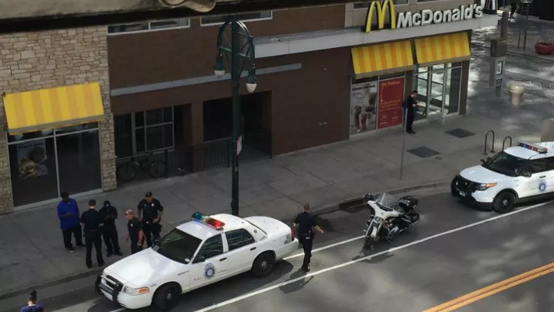 Image: Denver police question an employee of the 16th Street Mall McDonald's who unknowingly purchased a stolen car, as seen on the McShelterDenver Instagram page.