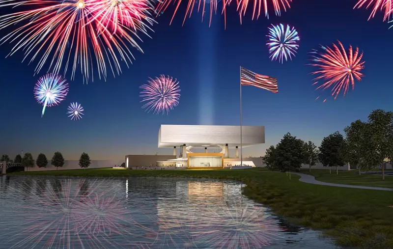 Image: museum with water in front, fireworks behind